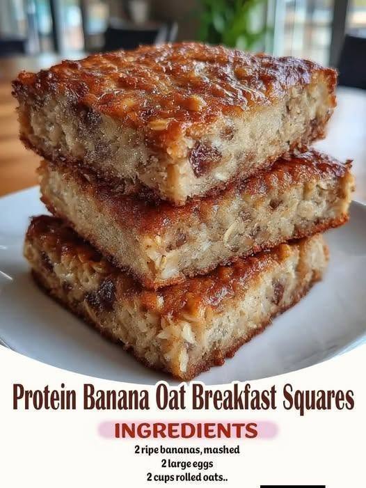 Protein Banana Oat Breakfast Squares: 1 Easy Recipe For The Perfect Healthy Meal 1 A top-down photo of healthy Protein Banana Oat Breakfast Squares showing a thick, chewy texture with visible rolled oats and chopped nuts.