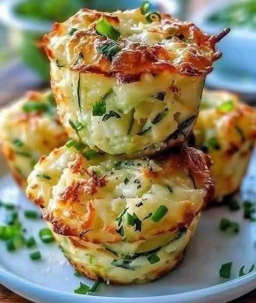 Golden and crispy Parmesan zucchini potato muffins served hot on a plate