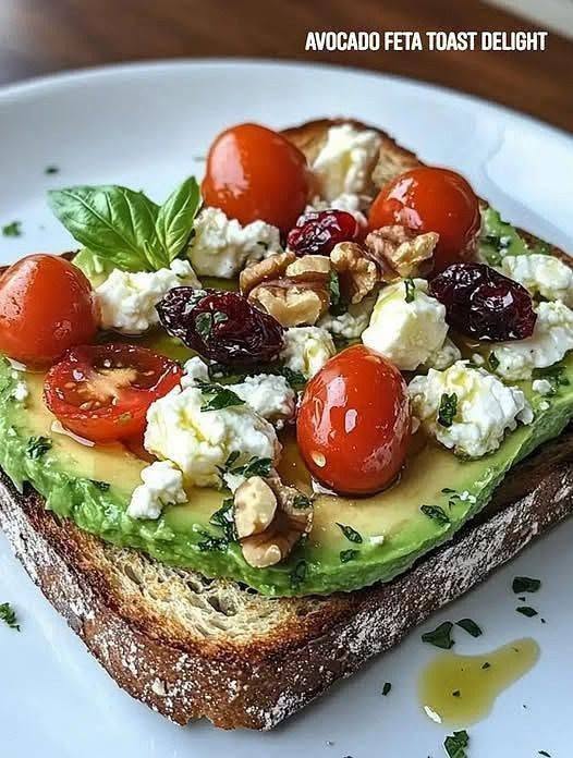 7 Secrets to Make the Ultimate Avocado Feta Toast Delight 1 A crispy slice of sourdough topped with avocado mash, crumbled feta, and red pepper flakes for an Avocado Feta Toast Delight