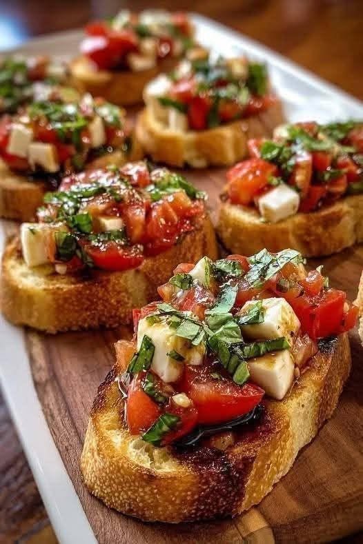 Best 15-Minute Tomato Basil Bruschetta Recipe 1 Toasted Italian bread topped with fresh Tomato Basil Bruschetta and a balsamic glaze drizzle