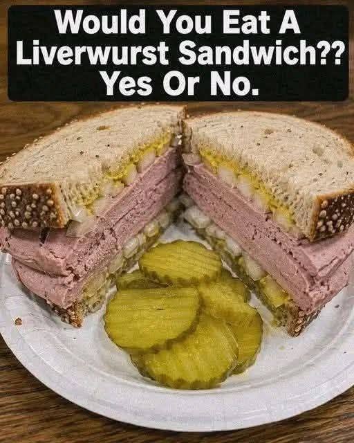 Liverwurst Sandwich on rye bread with lettuce, tomato, red onion, mustard, and dill pickles