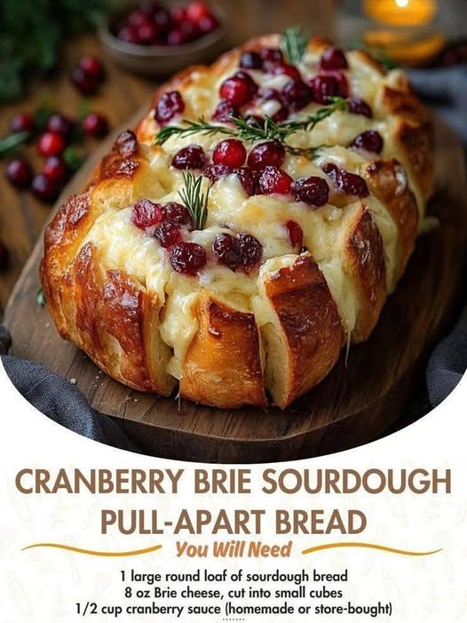 Cranberry Brie Sourdough Pull-Apart Bread with melted Brie cheese, cranberry sauce, rosemary, and crusty sourdough