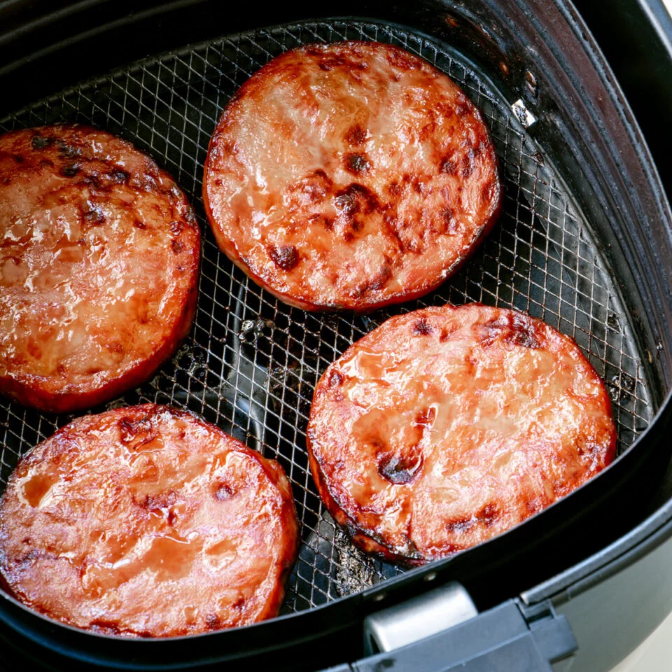Air Fryer Glazed Ham Steaks coated in a sweet brown sugar and honey glaze